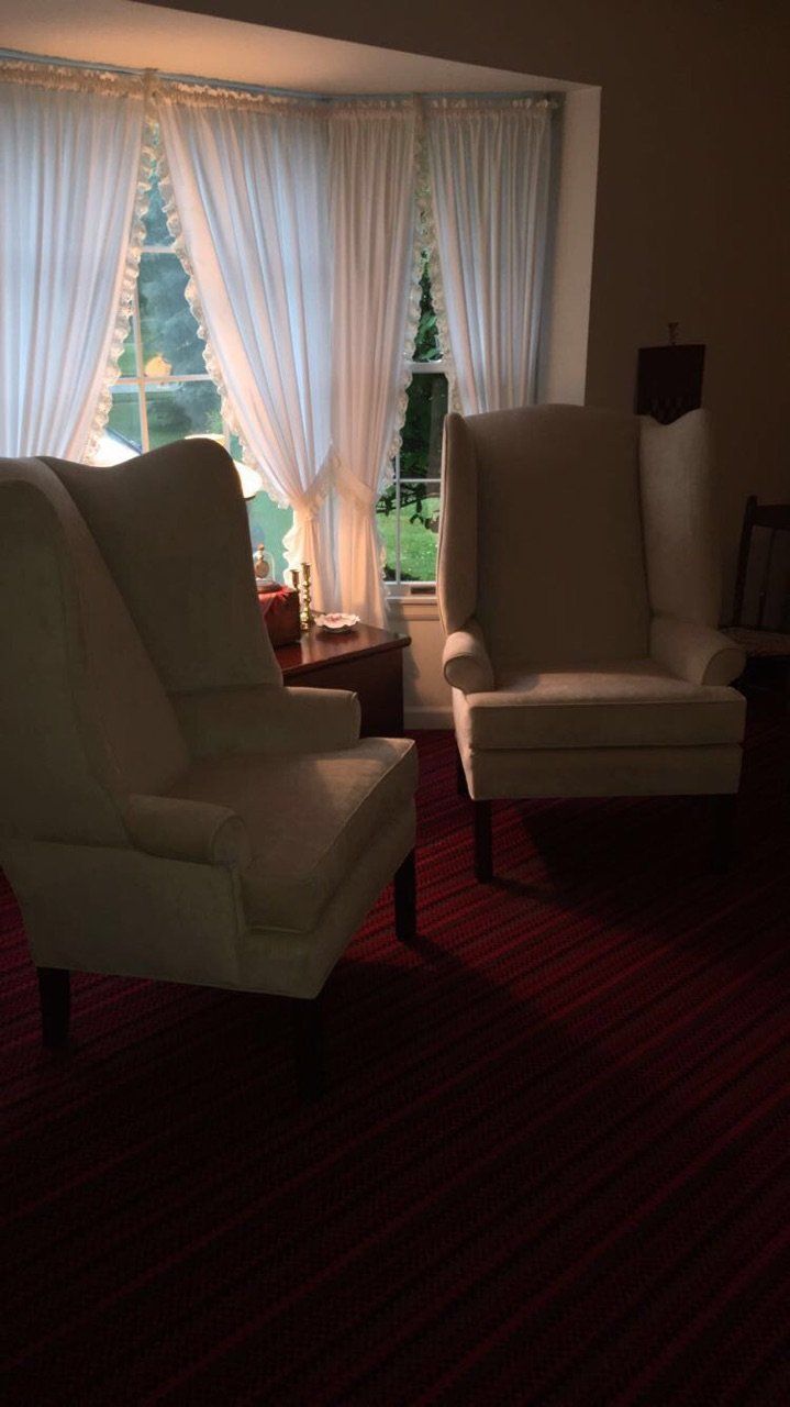 Two arm chairs after seating upholstery service