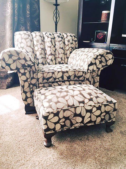 An arm chair and ottoman our upholstery company worked on