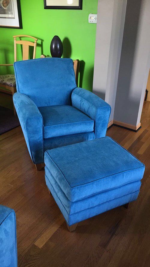 Furniture upholstery done on an arm chair and ottoman near Buffalo, NY