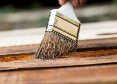 Applying protective varnish to deck - Deck Staining in Dover, PA Applying protective varnish to deck - Deck Staining in Dover, PA