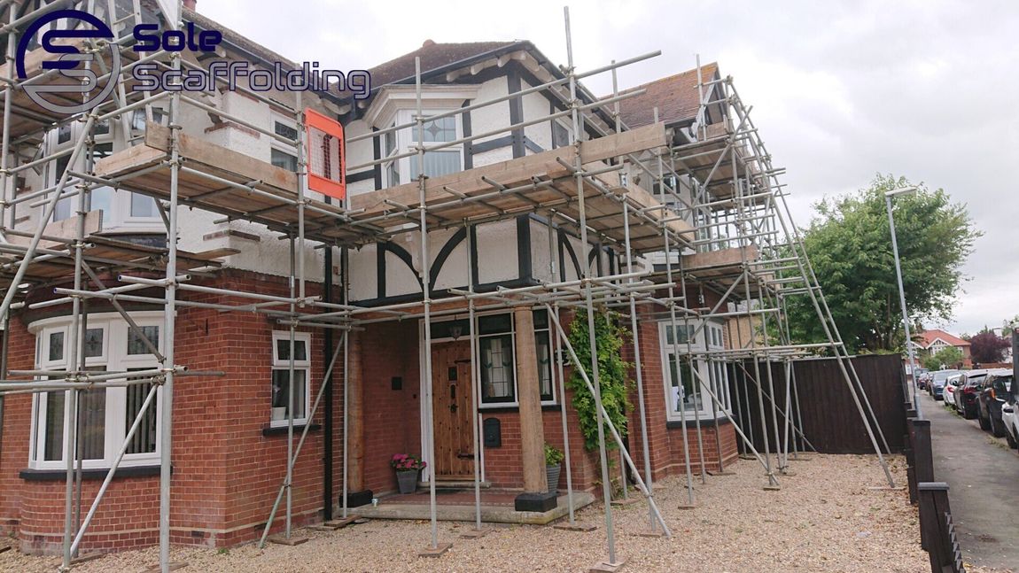 sole scaffolding - scaffold for painting works on a house in March