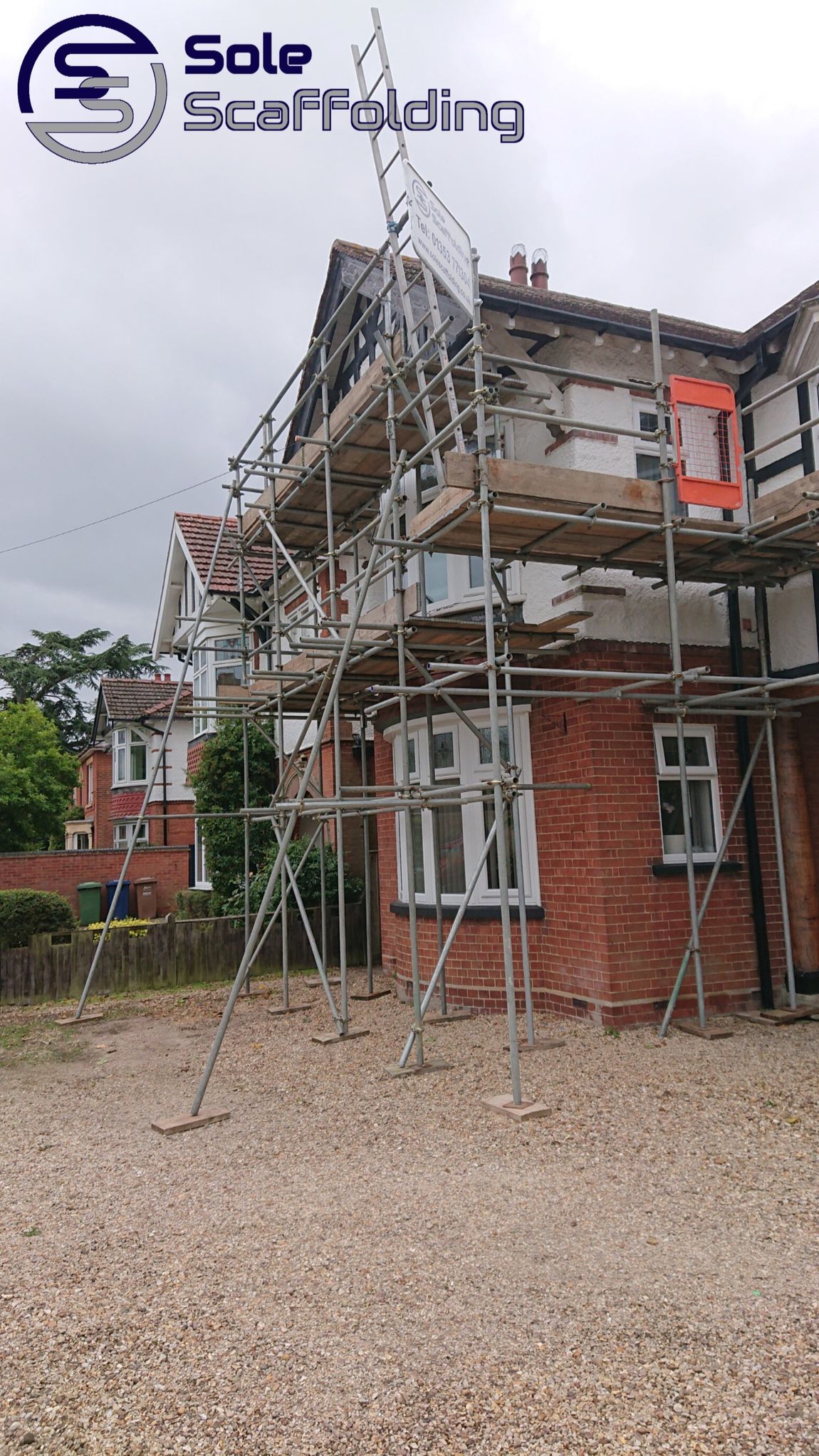sole scaffolding - scaffold for painting works on a house in March