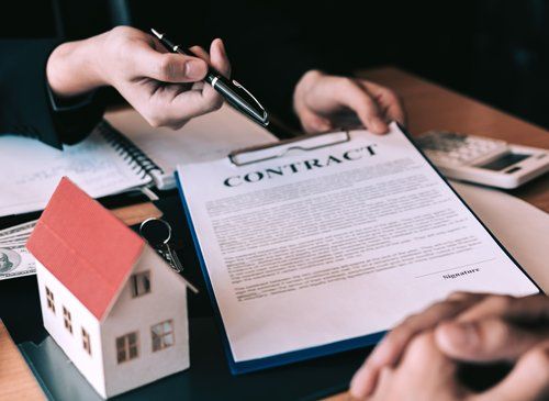 Customers Signing a Contract — De Pere, WI — One Law Group S.C Customers Signing a Contract — De Pere, WI — One Law Group S.C