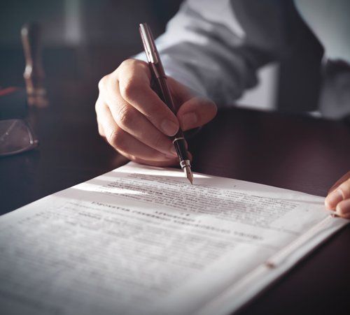 Notary Signing a Contract — De Pere, WI — One Law Group S.C Notary Signing a Contract — De Pere, WI — One Law Group S.C