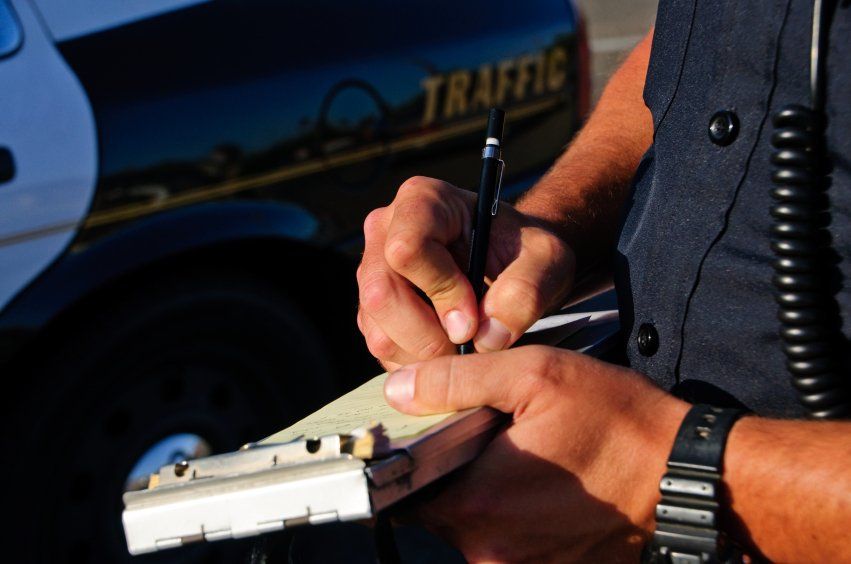 Police Writing a Ticket — De Pere, Wi — One Law Group S.C Police Writing a Ticket — De Pere, Wi — One Law Group S.C