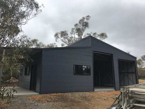 Black shed with doors and windows - Snowy Sheds