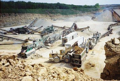 Blasted Rock — A Bulldozer With Two Red Cars in Janesville, WI Blasted Rock — A Bulldozer With Two Red Cars in Janesville, WI
