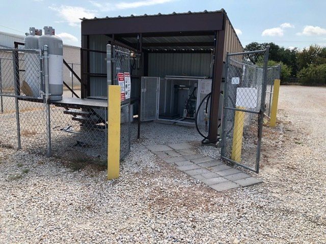 Propane Tank Maintenance — Propane Tank Being Filled Up in Lipan, TX Propane Tank Maintenance — Propane Tank Being Filled Up in Lipan, TX