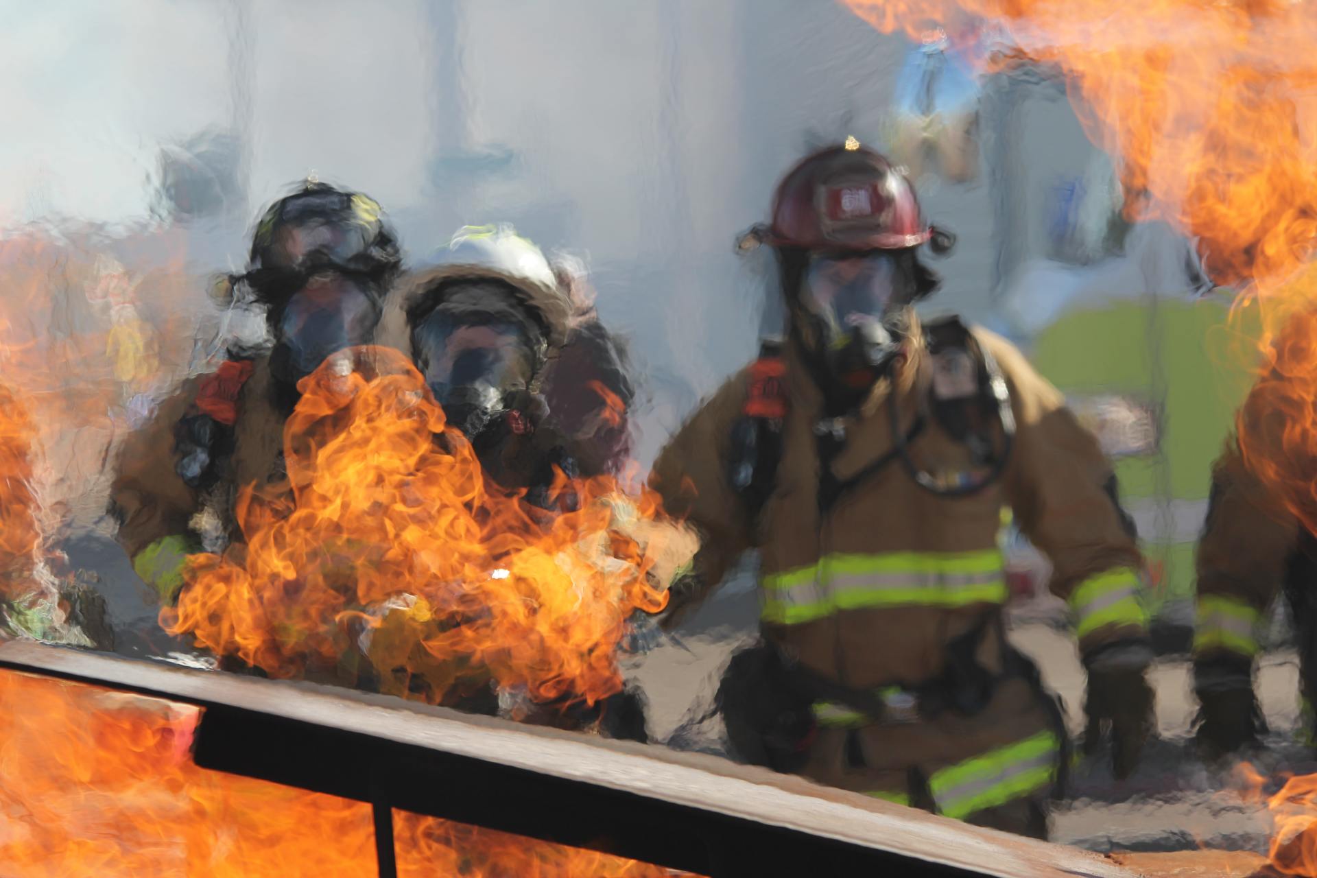 Orange flames, fire figthers in action