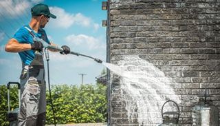 Power Washing the Wall — Kansas City, KS — The Kansas Paint Company Power Washing the Wall — Kansas City, KS — The Kansas Paint Company