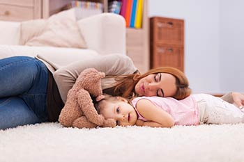Floor Specialists — Mother and Daughter Sleeping on Carpet in Wilmington, DE