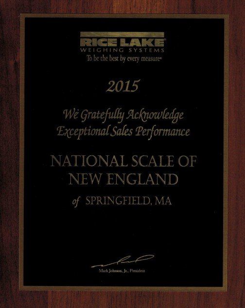 Wood-framed black award plaque for National Scale of New England, congratulating exceptional sales performance.