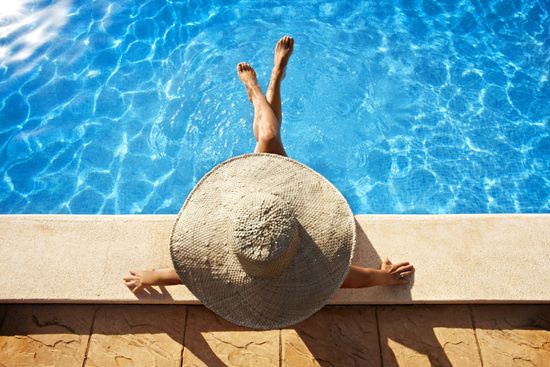 Pool — Woman Sitting in the Poolside in Cantonment, FL Pool — Woman Sitting in the Poolside in Cantonment, FL