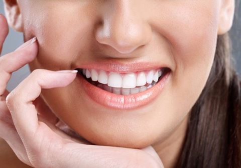 a lady with healthy and strong teeth