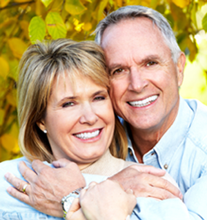 a elderly couple smiling confidently