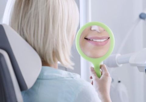 a lady looking into the mirror