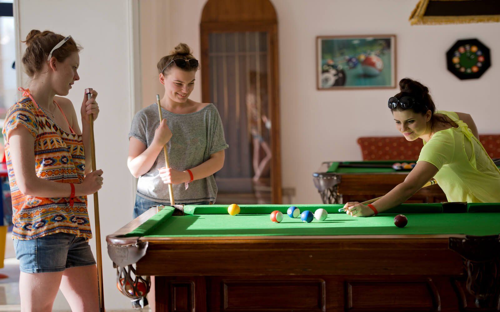 Guests enjoying a game of billiard