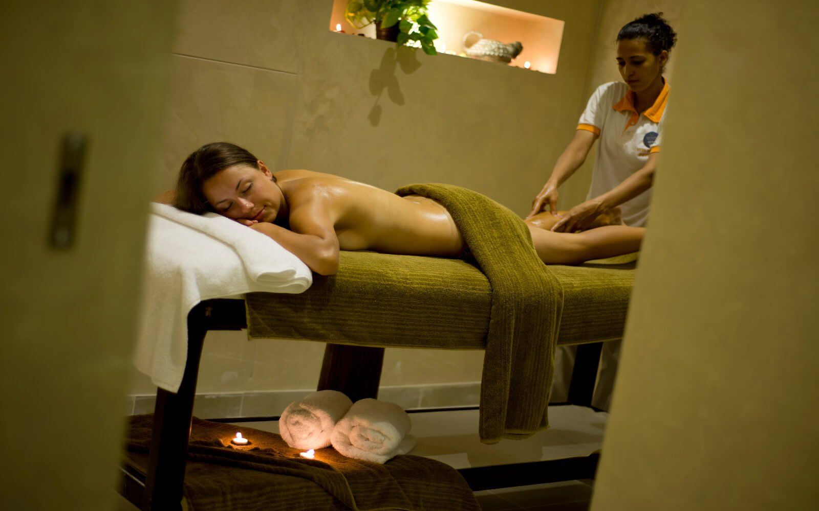 Guest enjoying spa massage at Amphoras Beach