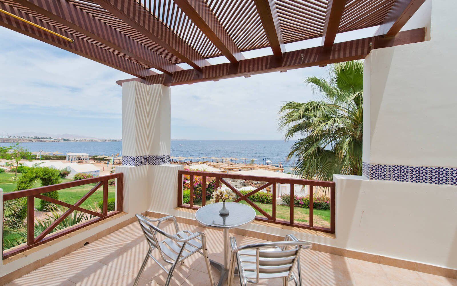 Private balcony with scenic views of the Red Sea and lush garden below
