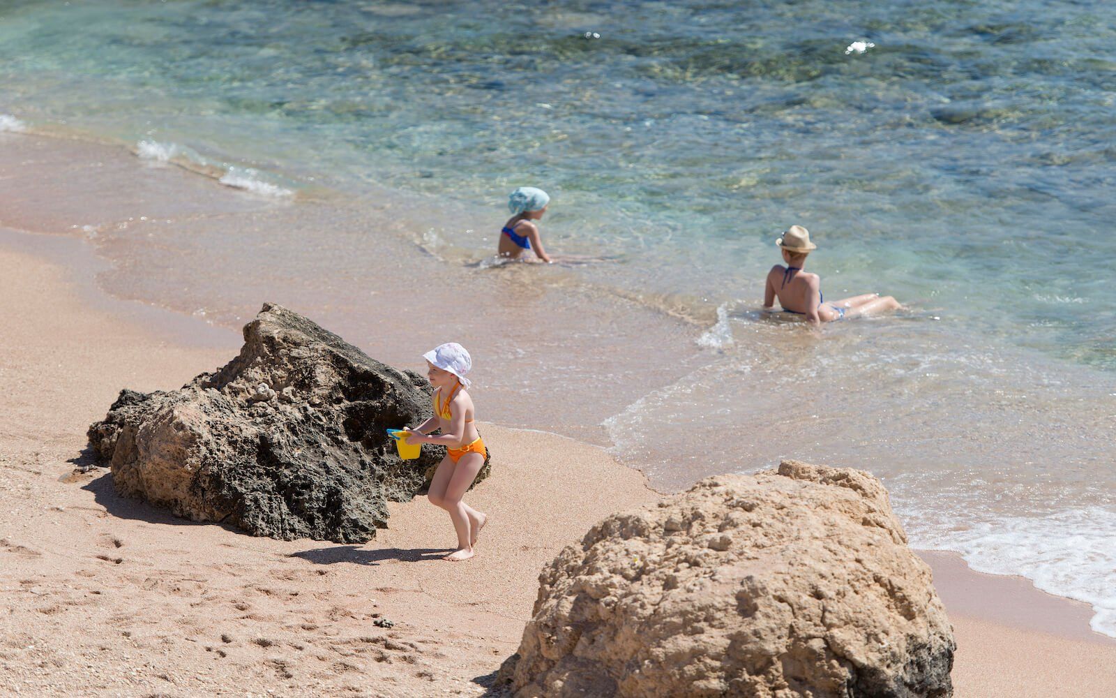 Kids playing on the beach at Amphoras Beach Resort