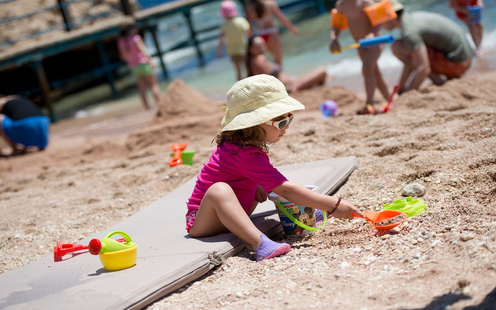 Kids playing on the beach at Amphoras Beach Resort