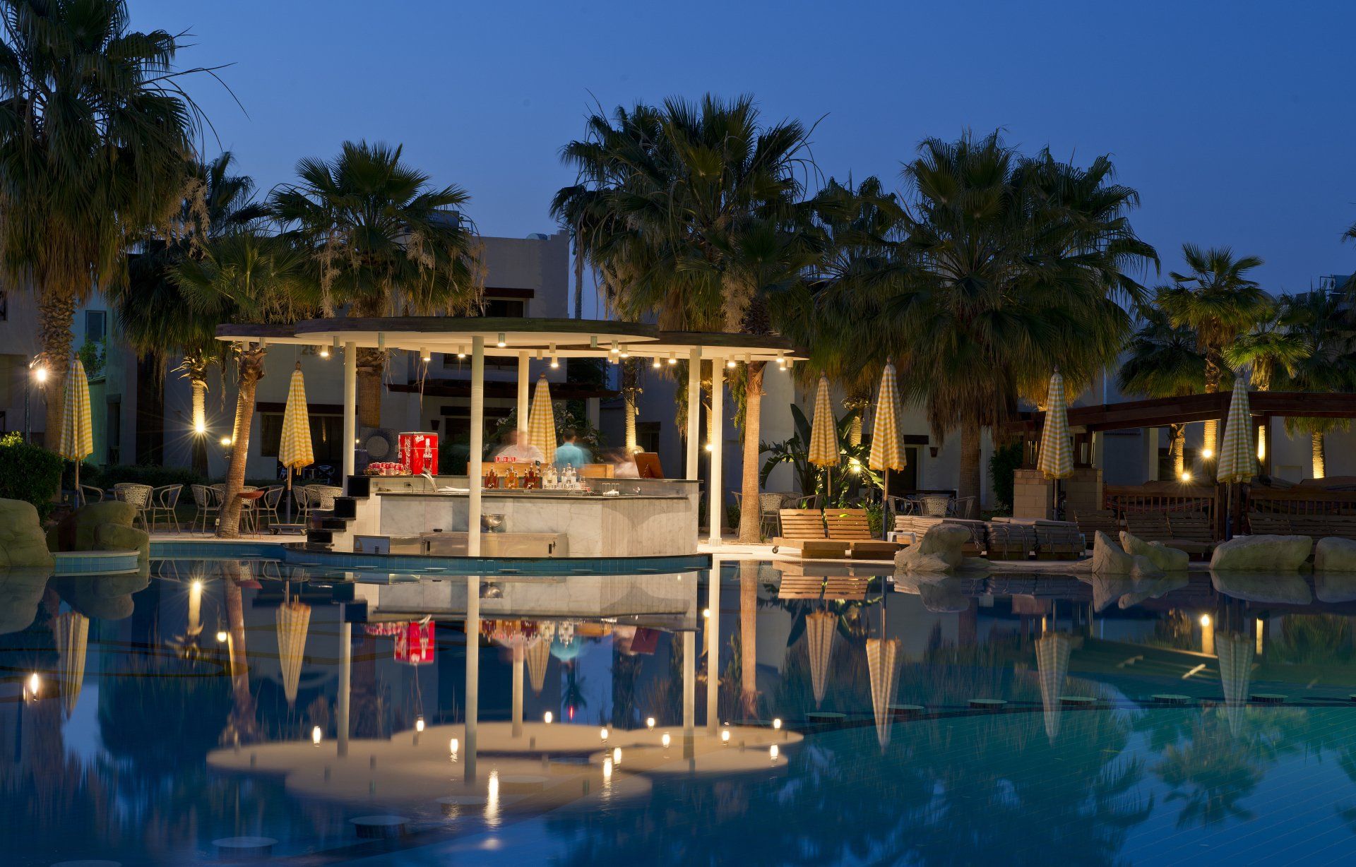 Night view of illuminated pool bar.