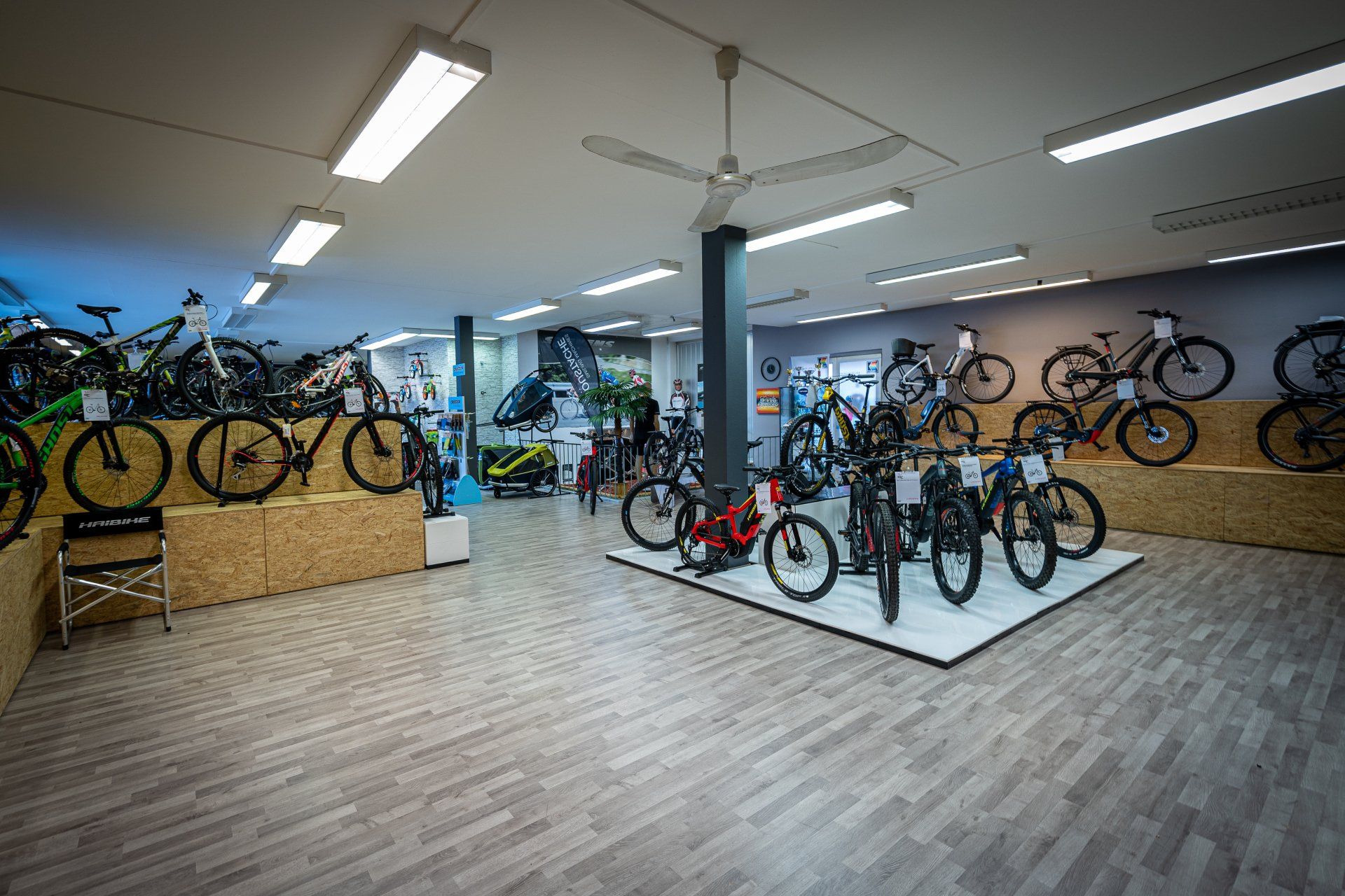 A bicycle store filled with lots of bicycles on display.