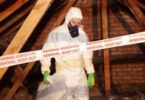 Abatement Contractor Wearing PPE in an Attic