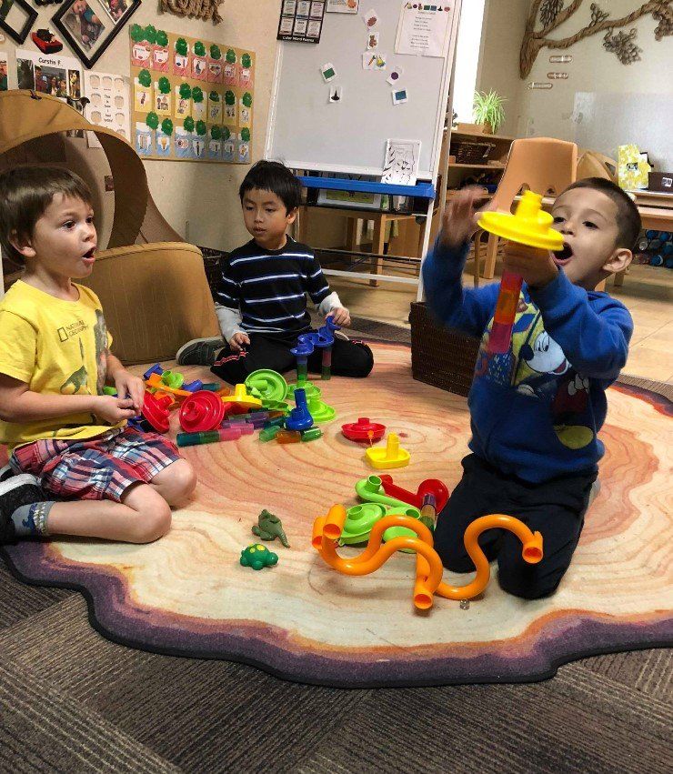 two children having an apple - child learning center in Moline IL two children having an apple - child learning center in Moline IL