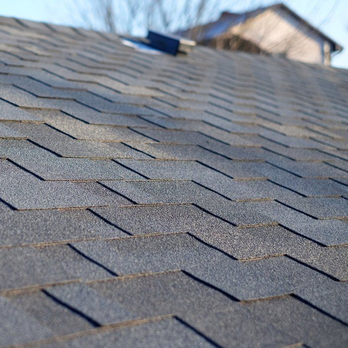 Fixing Roof Using Hammer — Lakewood, CO — Watershed Roofing & Restoration