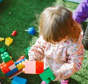 kid playing with blocks