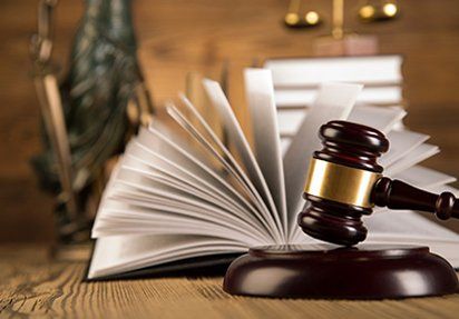 Lady of justice, gavel and books on wooden table — Law in Morris Plains, NJ Lady of justice, gavel and books on wooden table — Law in Morris Plains, NJ