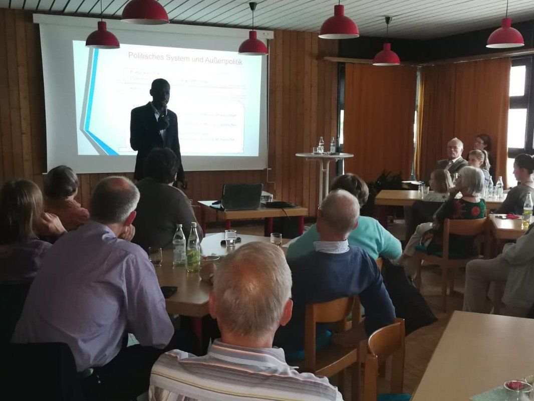 A man is giving a presentation to a group of people