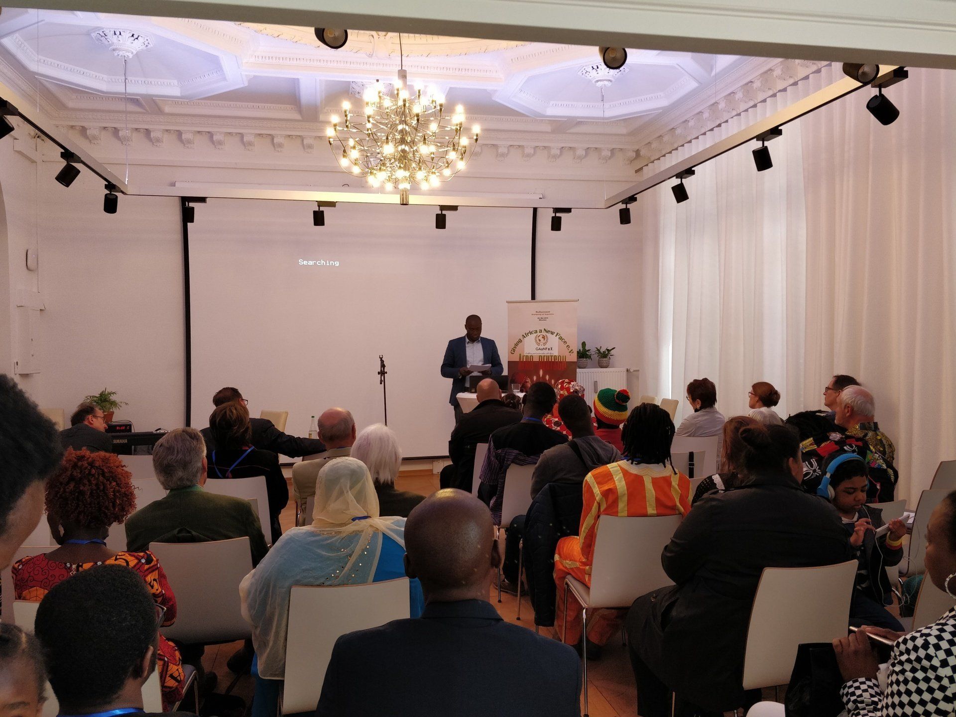 A man is giving a presentation to a group of people