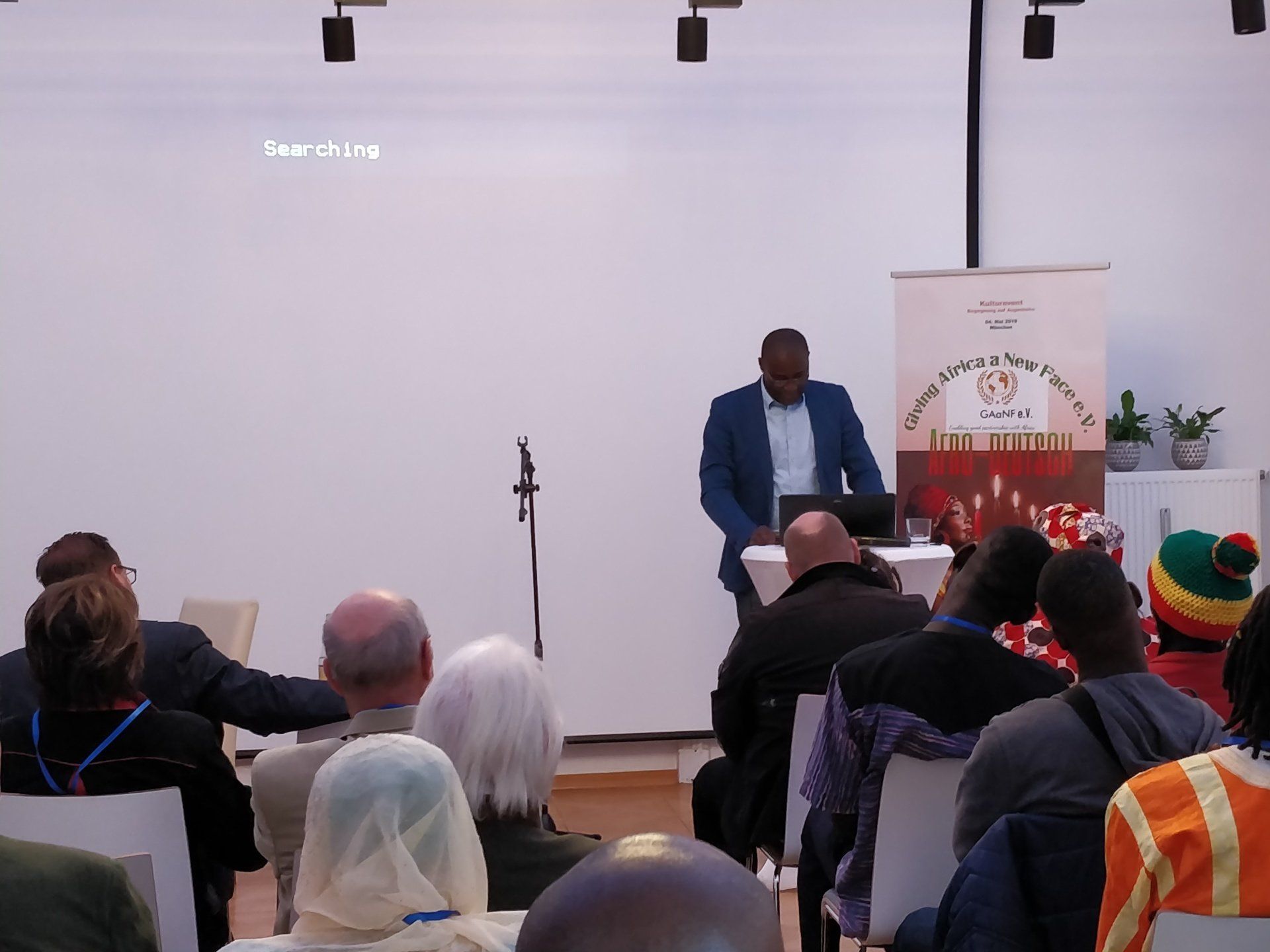 A man is giving a presentation to a group of people