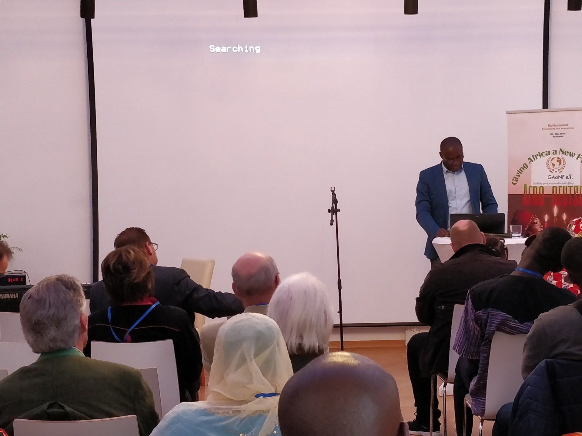 A man is giving a presentation to a group of people