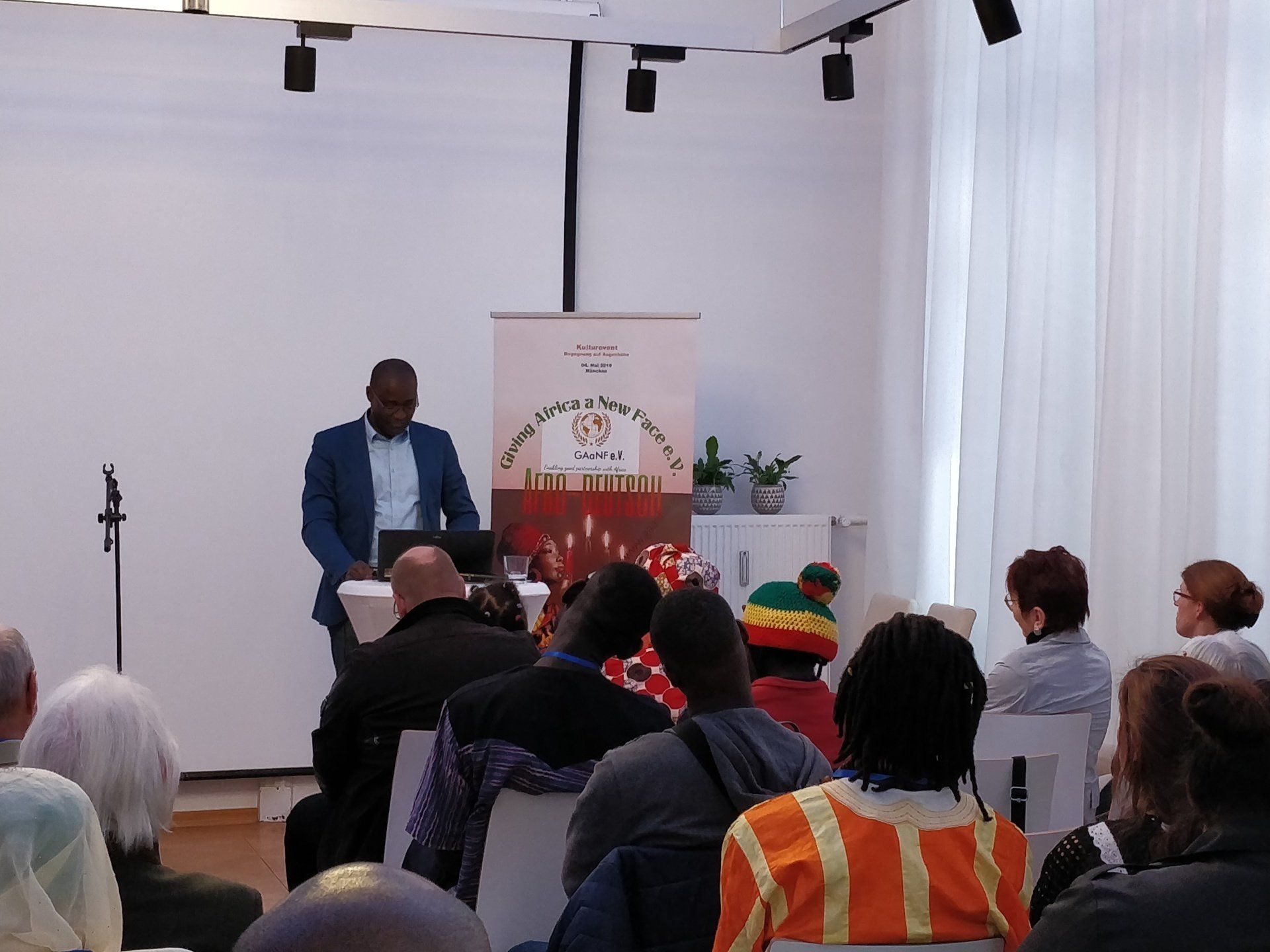 A man is giving a presentation to a group of people