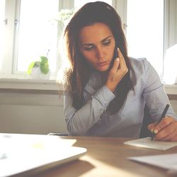 Young female writing notes - Bankruptcy Practitioner in Elizabethton, TN
