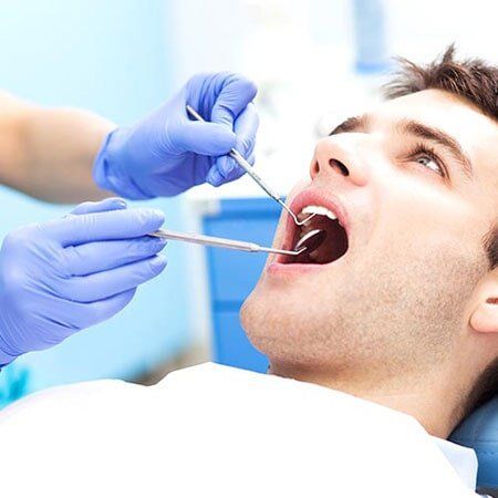 Man having teeth examined - Dental Service in Green River, WY Man having teeth examined - Dental Service in Green River, WY