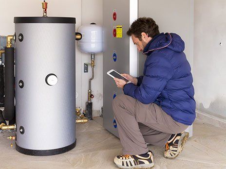 Water Heater – Man Inspecting the Water Heater in Westchester, IL Water Heater – Man Inspecting the Water Heater in Westchester, IL