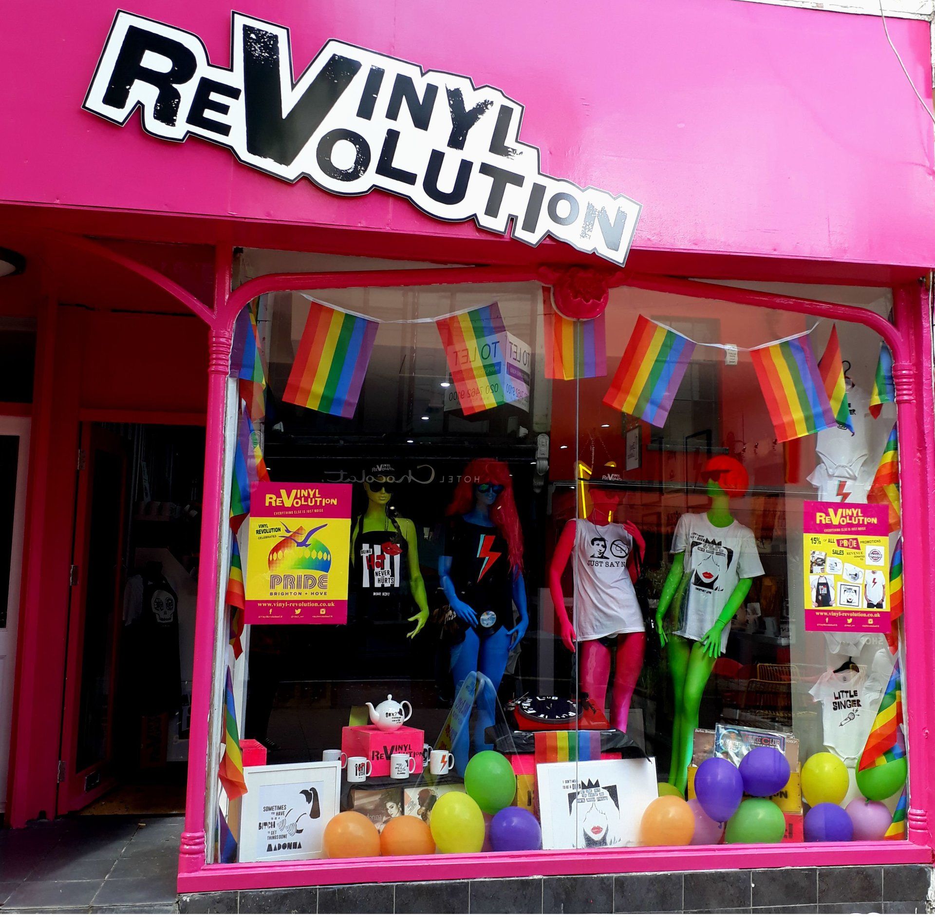 The front of a store called vinyl revolution