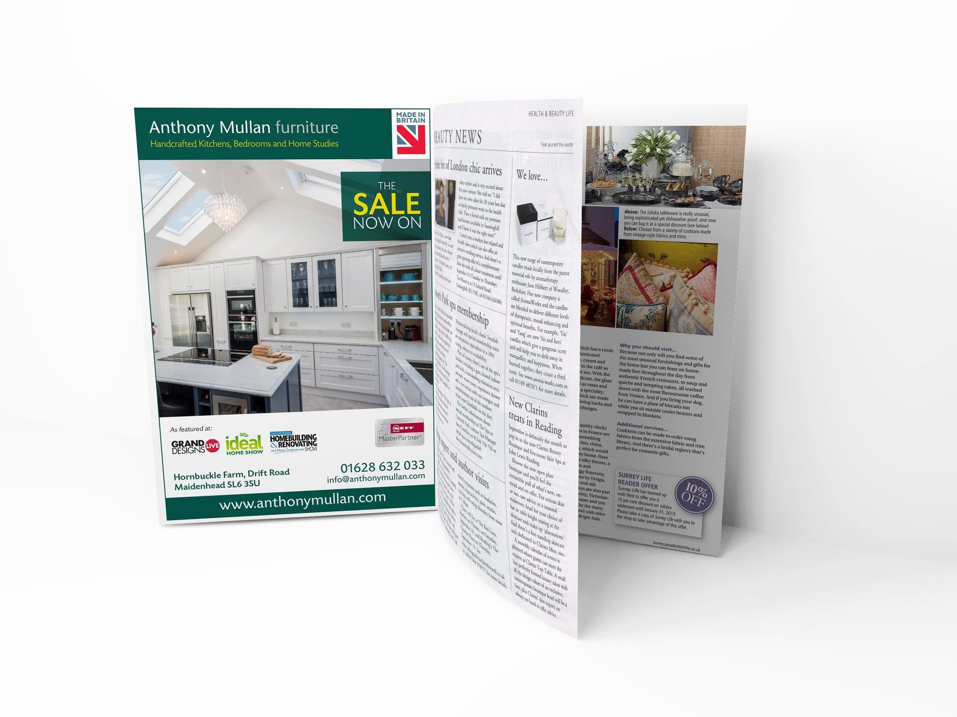 a magazine is open to a page with a picture of a kitchen on it .