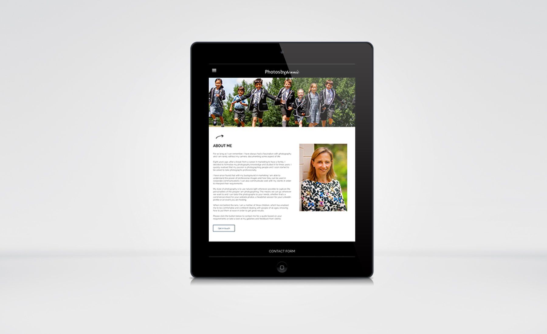 A tablet with a picture of a woman on the screen.