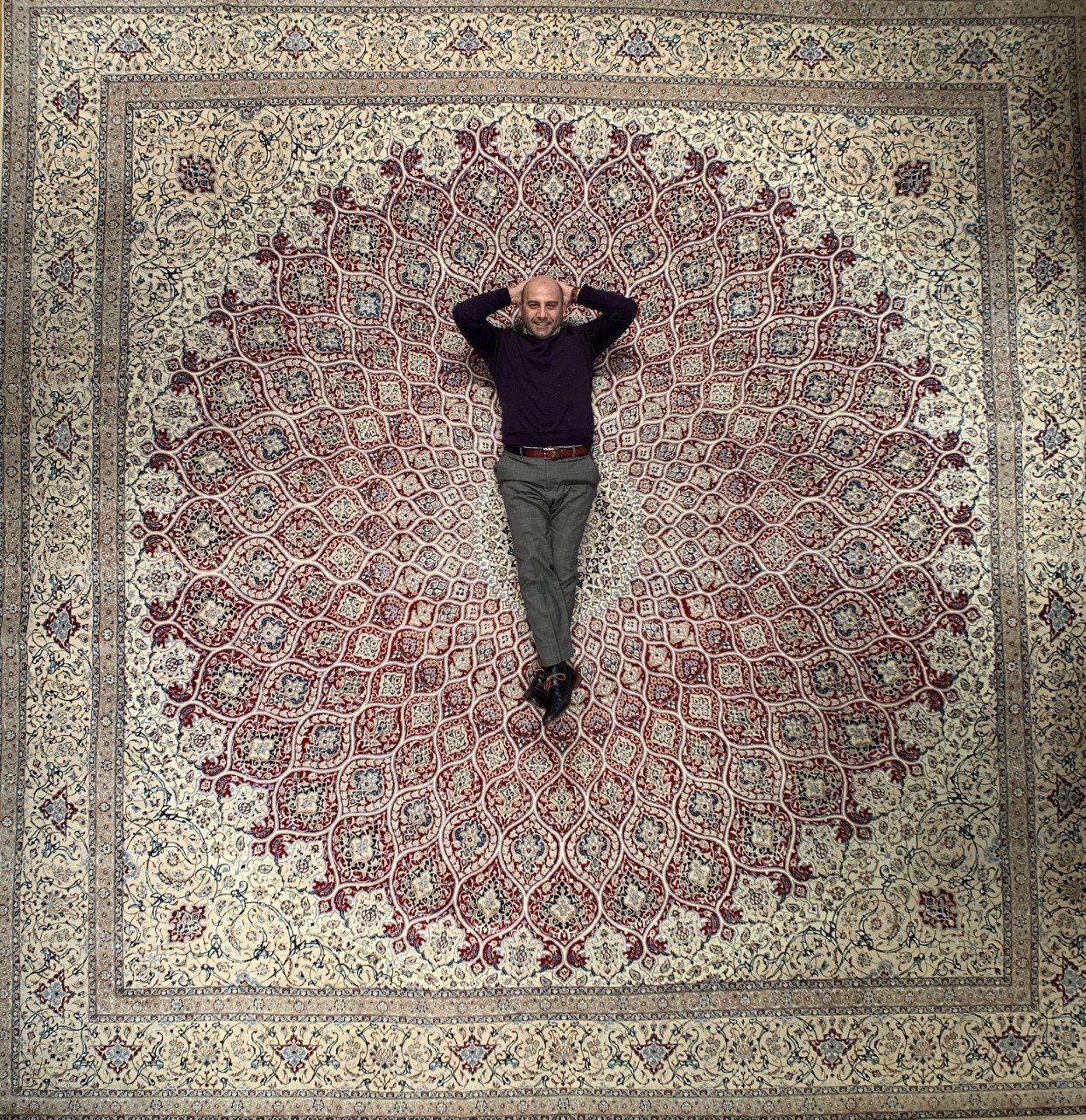 Man Lying on a Modern Carpet — Milwaukee, WI — Shabahang and Sons Persian Carpets