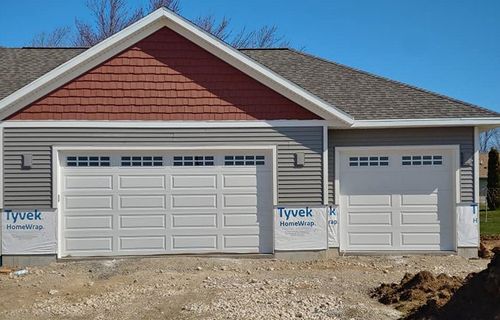 Garage Doors During Installation — Port Washington, WI — Jiffy Overhead Door, LLC Garage Doors During Installation — Port Washington, WI — Jiffy Overhead Door, LLC