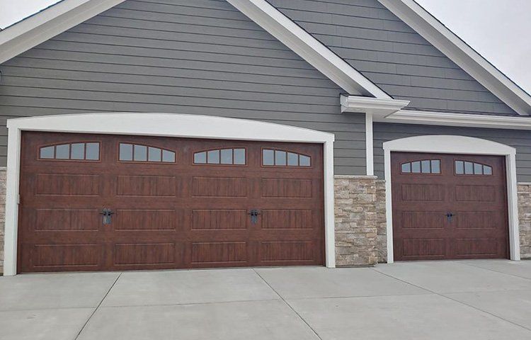 Dark Wooden Garage Doors — Port Washington, WI — Jiffy Overhead Door, LLC Dark Wooden Garage Doors — Port Washington, WI — Jiffy Overhead Door, LLC