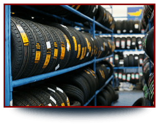 For new and part worn tyres in Coventry call Mason Road Garage Two racks stocked with tyres facing each other.