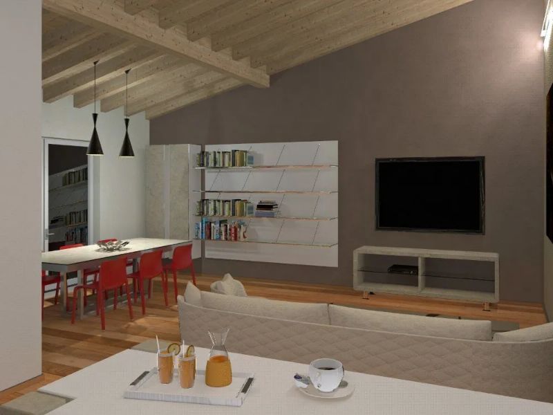 open space con parquet e soffitto a travi in legno