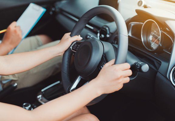 Instructor Scoring Woman Driving — North Hills, CA — Atlas Driving & Traffic School