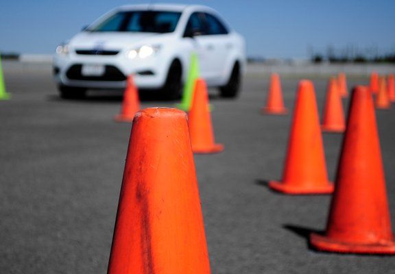 White Car And Orange Cones — North Hills, CA — Atlas Driving & Traffic School